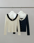 17a36 Off-shoulder knit top with ruffled neckline
