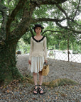 17a36 Off-shoulder knit top with ruffled neckline