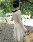 17a36 Off-shoulder knit top with ruffled neckline
