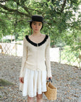 17a36 Off-shoulder knit top with ruffled neckline