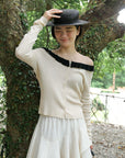 17a36 Off-shoulder knit top with ruffled neckline