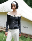 17a36 Off-shoulder knit top with ruffled neckline