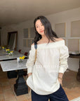 16a28 Off-shoulder long-sleeve cotton top