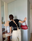 16A73 Back cut-out Mongtoghi tee with pearl buttons