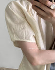14a7 Round-neck blouse with side-gathered waist