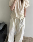 14a7 Round-neck blouse with side-gathered waist