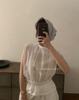 14a3 Sleeveless lace top with ruffled neckline and bodice