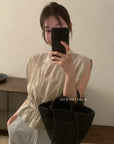 14a3 Sleeveless lace top with ruffled neckline and bodice