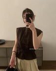 14a3 Sleeveless lace top with ruffled neckline and bodice