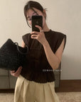14a3 Sleeveless lace top with ruffled neckline and bodice