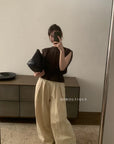 14a3 Sleeveless lace top with ruffled neckline and bodice