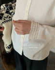 20a106 Beaded-collar textured shirt