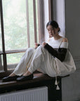 17A28 Off-shoulder Mongtoghi cashmere top with button detail