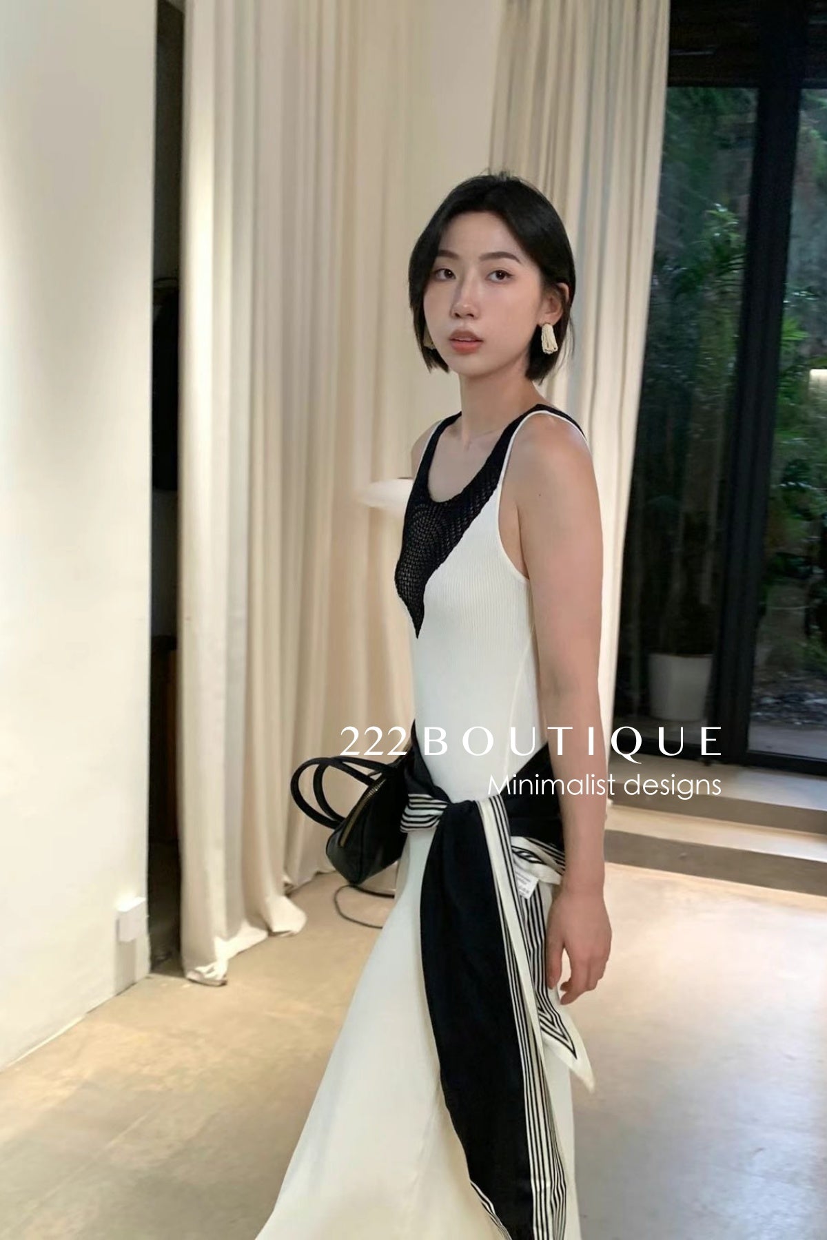 15v32 Mesh panel knit dress – bold lines, soft drape