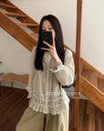 17a3 Long blouse with ruffled details