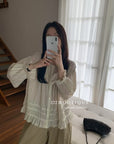 17a3 Long blouse with ruffled details