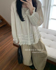 17a3 Long blouse with ruffled details