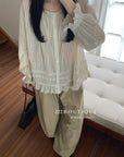17a3 Long blouse with ruffled details