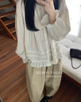 17a3 Long blouse with ruffled details