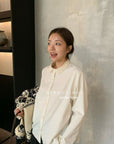 20a106 Beaded-collar textured shirt